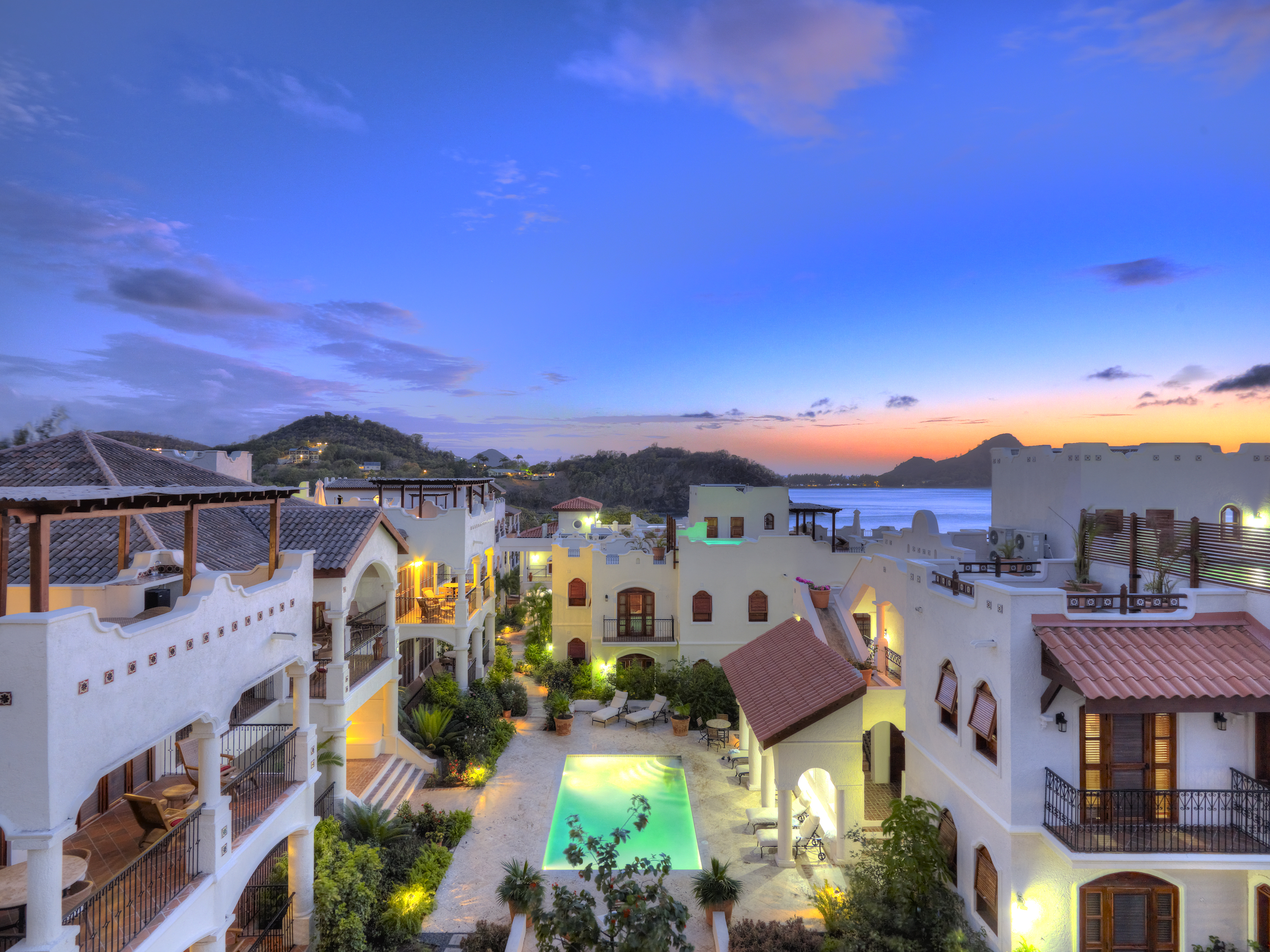 Early-evening-shot-over-pool Cap Maison Resort & Spa