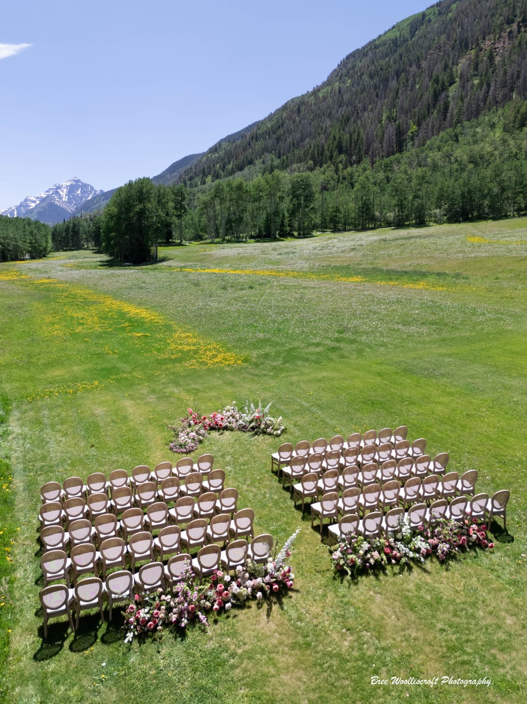 6-14-25-bree-woolliscroft-photography-main-meadow-ceremony-decor-aerial-view-credited T-Lazy-7 Ranch