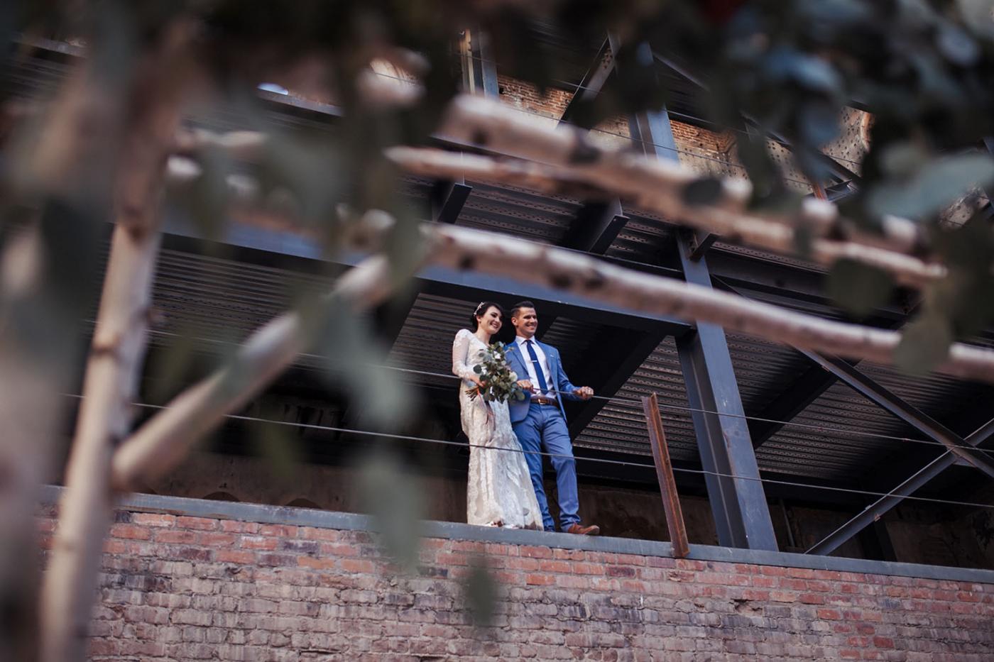 married couple standing on balcony