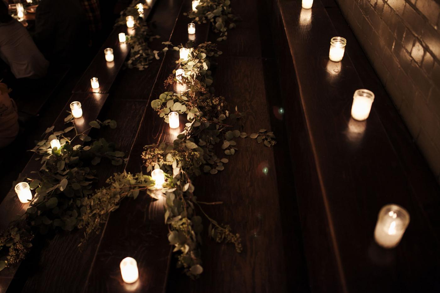 candles and plants lining benches