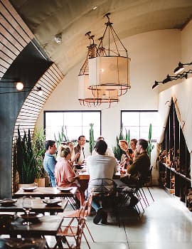 Guests gathered at a lively indoor dining space