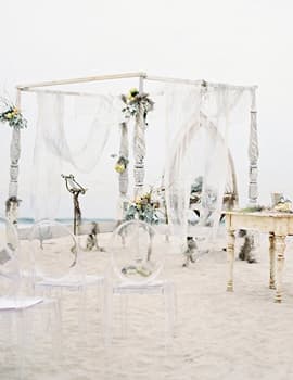 Outdoor wedding ceremony arch by the water
